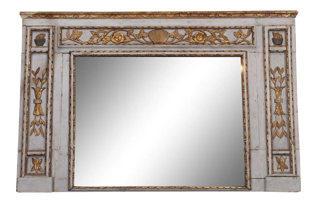 19th Century French Painted Mirror: Early 19th century French Painted and gilded mirror with original glass. Painted a french blue color with gilded floral carving all around. This mirror was part of a boiserie. Lots of cracks and