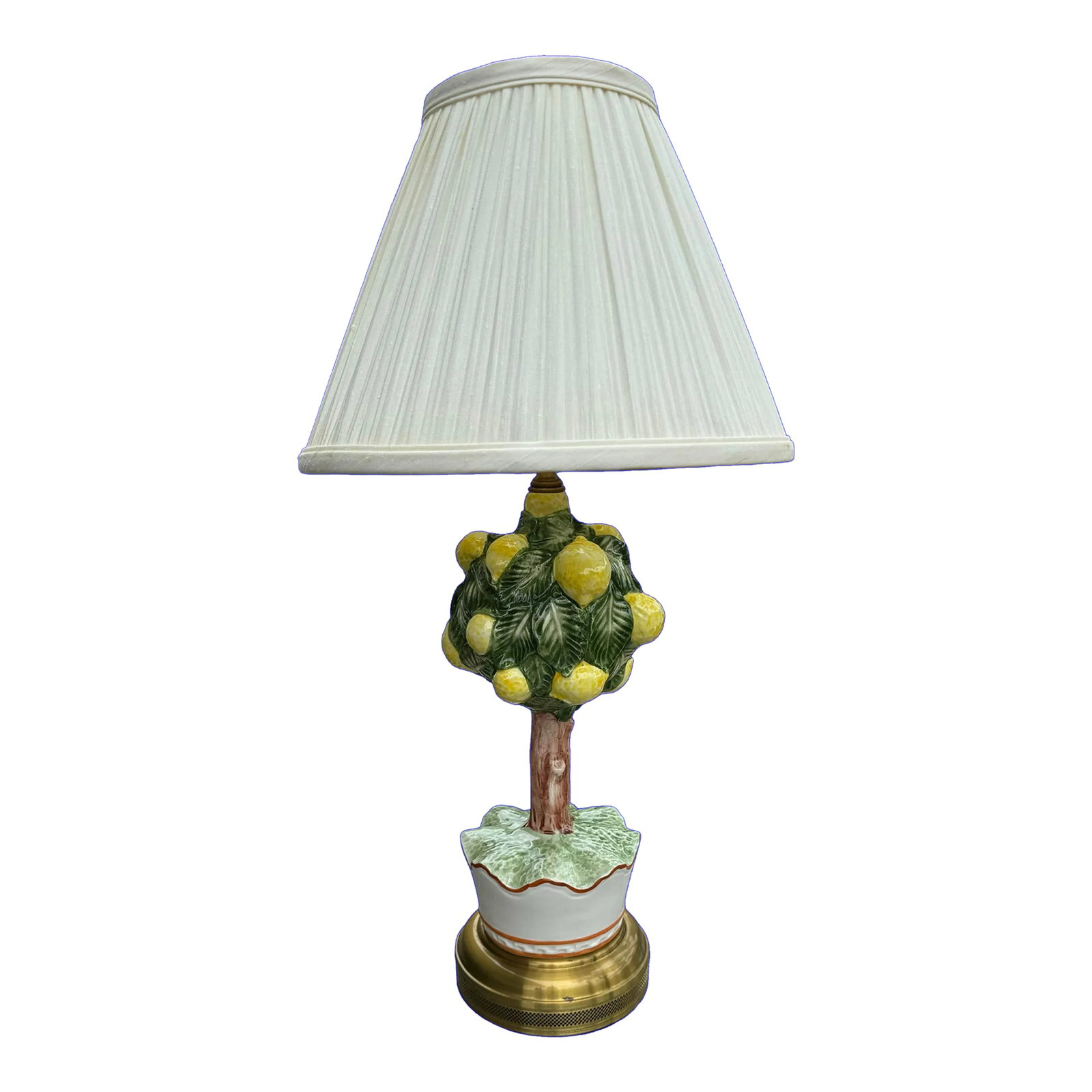Vintage Wildwood Lemon Topiary Lamp: Vintage ceramic lemon topiary tree made by Wildwood Lamps. 3- way switch, lamp sets on a brass base. Has original pleated shade. Lamp measures 23.5" to top of finial, 18" to top of socket. Condition: 