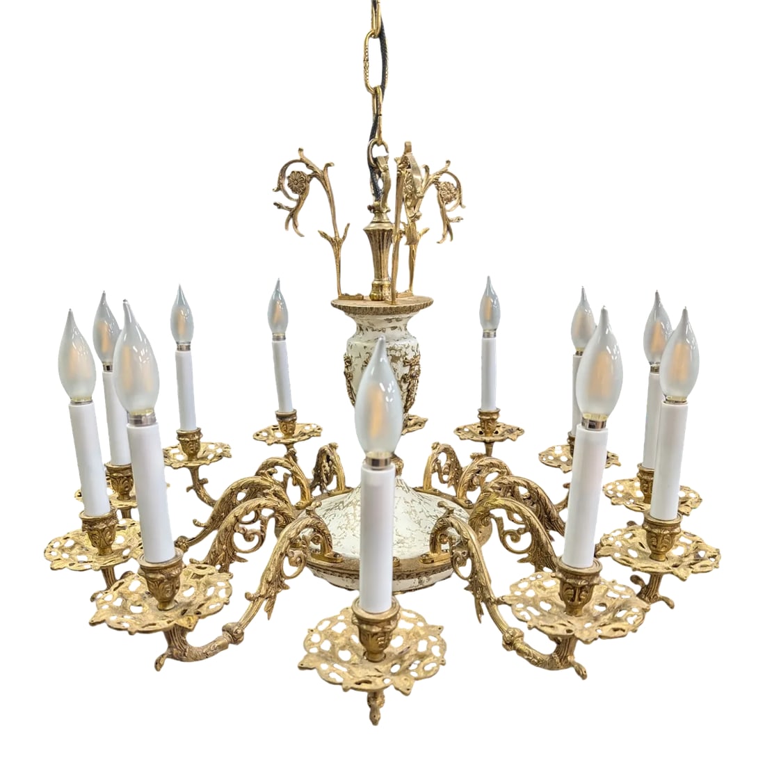 Vintage Louis XVI Style Chandelier: Beautiful and stylish vintage 12-light chandelier circa 30s. This classy Louis XVI style chandelier is solid and well crafted of gilt bronze and enameled metal. Each arm is ornate, featuring a floral 