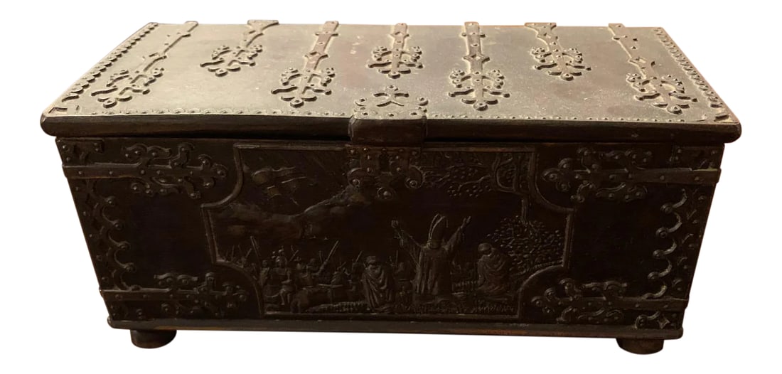 Vintage Cast Iron Box: A vintage Iron Art Denmark cast iron casket box. The rectangular shape box has a hinged lid, handles to the sides, and footed base. The front depicts a scene from the 1219 Battle of Lyndanisse, during