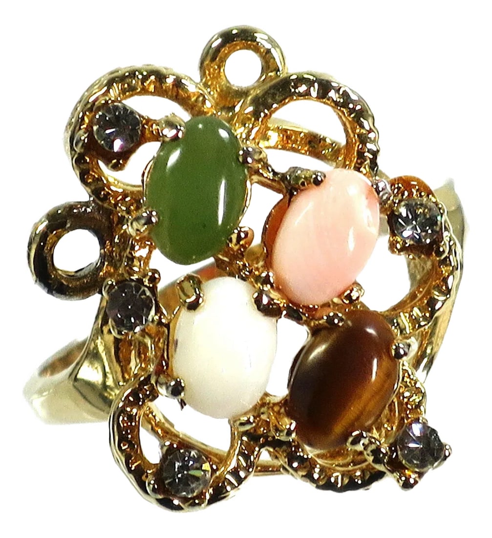 Vintage 1970s Cocktail Ring, Jade Opal Coral: Vintage 1970s 18k gold-plated semi-precious stones cocktail ring. Tall tiered textured setting with oval cabochons of jade, opal, tigers eye, and angel skin coral, accented with tiny clear CZs. The