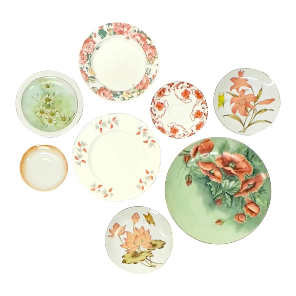 Tangerine & Green Floral Wall Plate Curation - Group of 8: Mixed orange and green decorative plates, group of 8. This an eye-catching set of floral decorative plates in a variety of designs and sizes with an overall white, tangerine-orange, and light-green