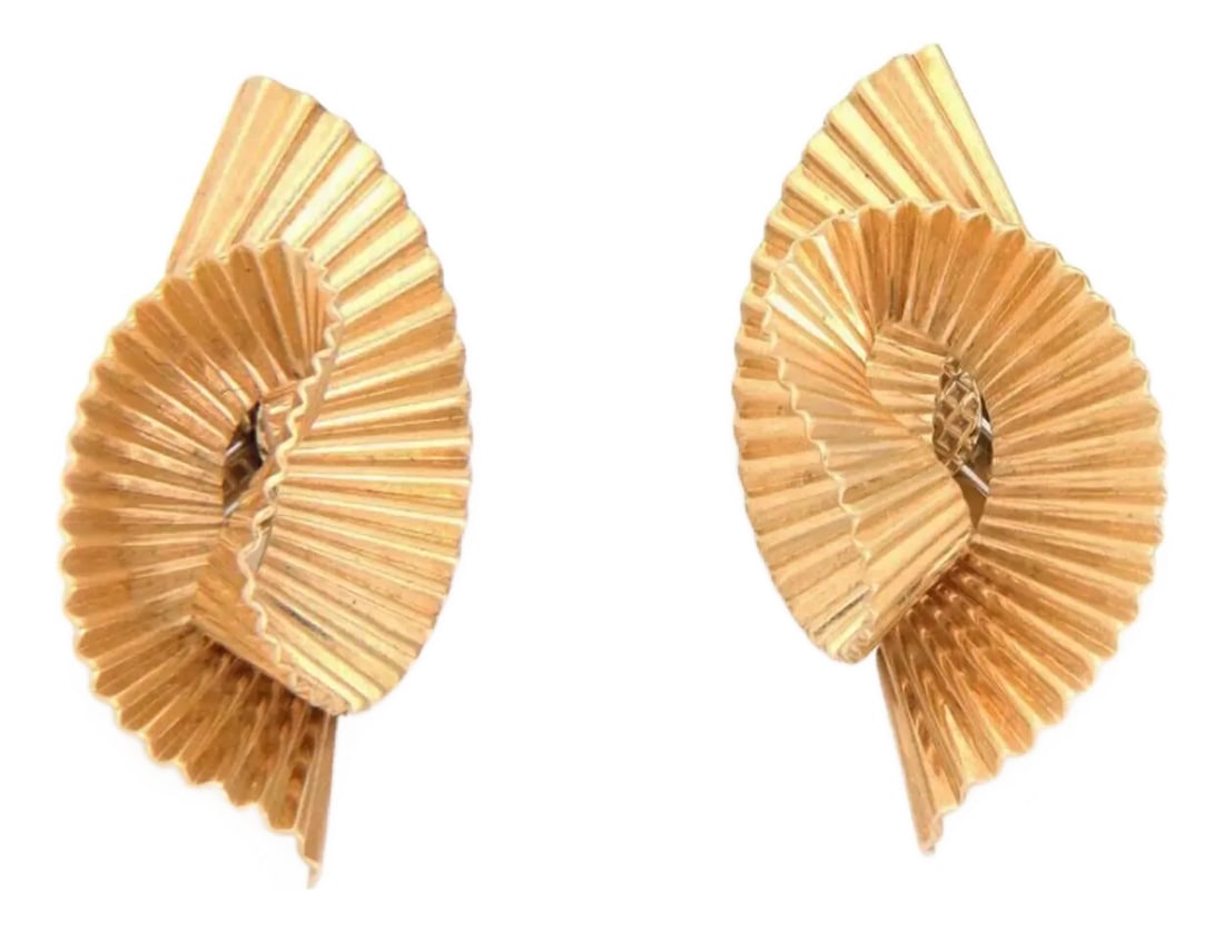 Tiffany & Co. 14k Yellow Gold Fluted Ribbon Twist Clip on Earrings, 2 Pieces: This is a beautiful pair of Retro Era earrings from Tiffany & Co. They are crafted from 14k yellow gold featuring a fine fluted design on a wide ribbon style fashioned into a twisted fold creating a