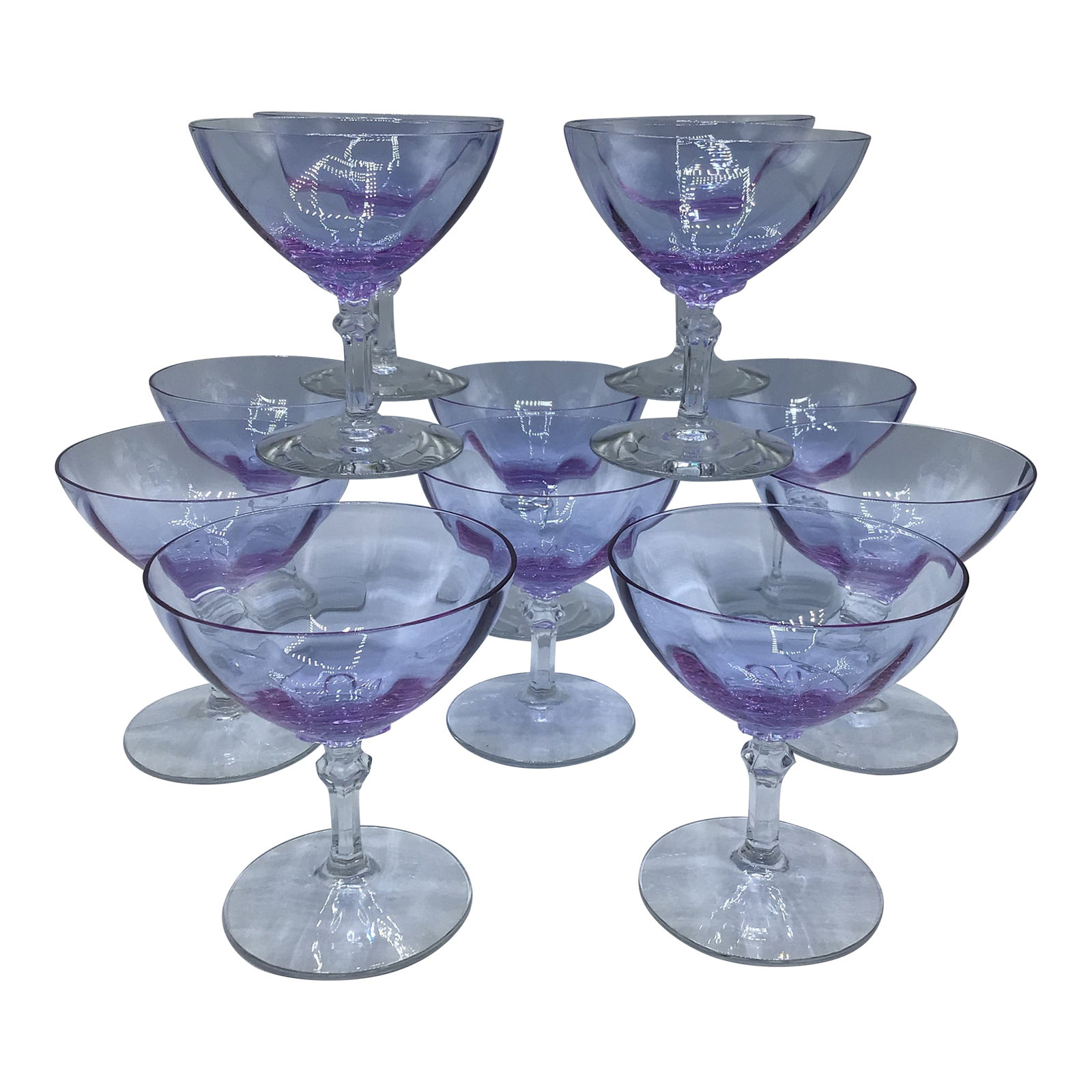 Art Deco Optic Wisteria Champagne/Sherbet Glasses by Fostoria Glassware-Set of 12: Beautiful set of 12 Art Deco style lavender hue coupes or sherbet glasses. Made by Fostoria Glass Company in the Mid 1930's. These glasses are stunning. Condition: Alterations: Original Condition