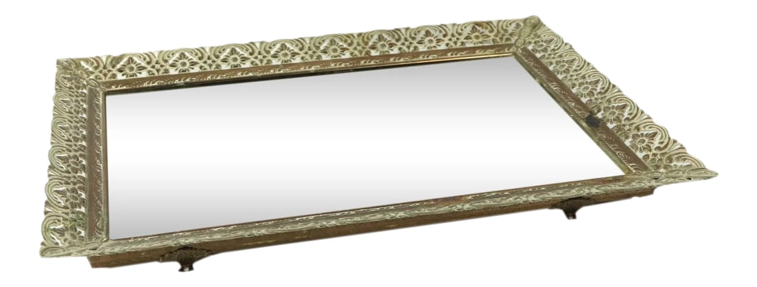 Vintage Hollywood Regency Floral Mirrored Vanity Perfume Tray: Vintage Hollywood Regnecy Ornate Floral Mirrored Vanity Bar Perfume Tray Tray Has some patina on the metal and scratches on the mirror Patina to the metal Measurements are: 15 inches top to bottom 10