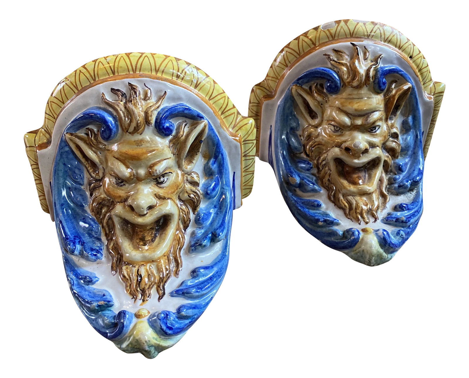 Vintage Cantagalli Satyr Majolica Wall Brackets - a Pair: Listing is for a pair of antique Cantagalli majolica wall brackets in blue and white and yellow depicting the mythological creature, Satyr. Cantagalli rooster mark is on each and heavy wire is wired