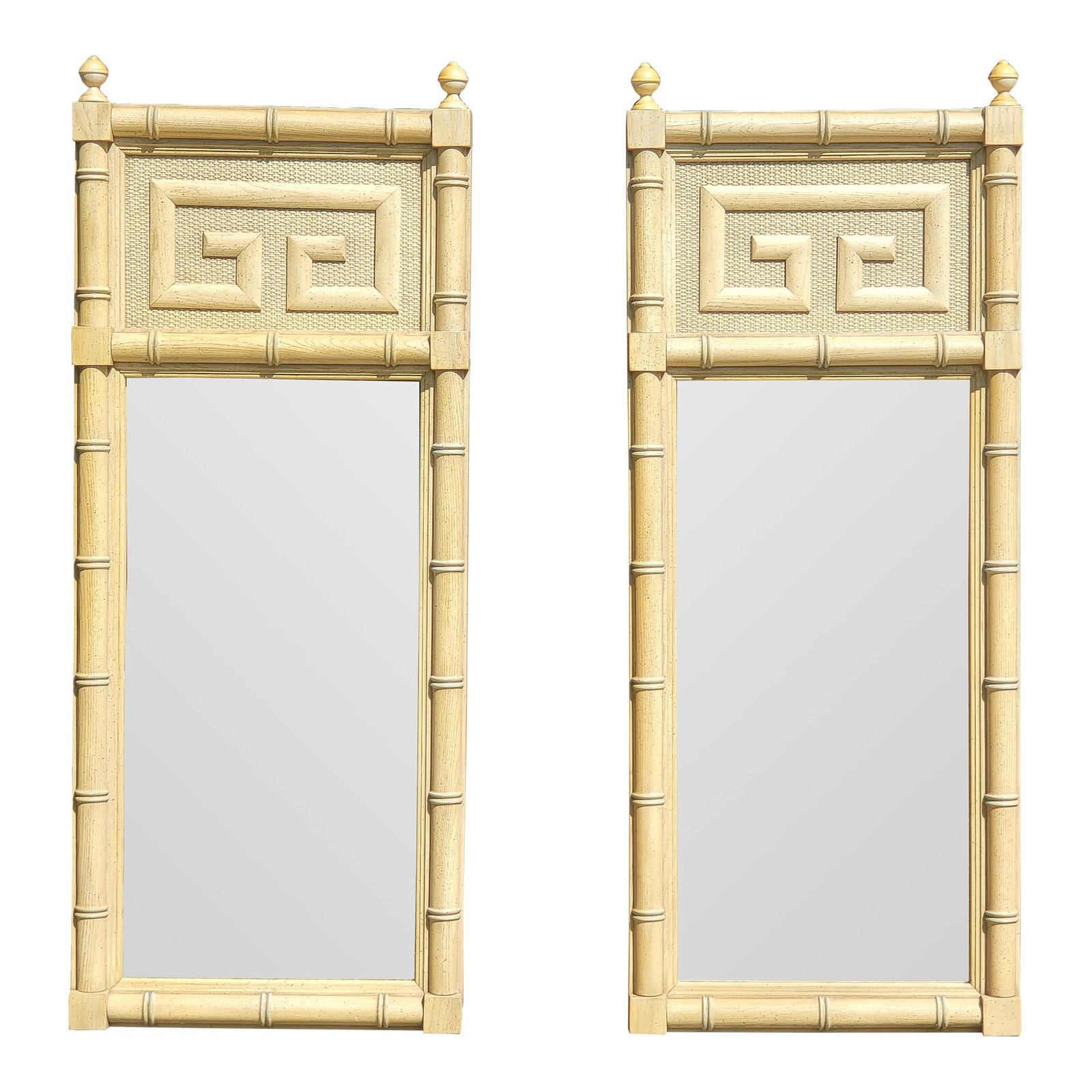 Vintage Dixie Shangri La Greek Key Faux Bamboo Mirrors-a Pair: Solid oak faux bamboo wall mirrors with a Greek key design situated on top of a cane background. A few of the photos were taken in the bright sunlight and show the mirrors as a light, bright yellow bu
