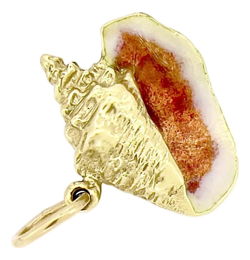 Vintage 18k Yellow Gold Orange Enamel Conch Shell Charm Pendant: About This Charm: This distinctive conch shell charm showcases a vibrant orange enamel that catches the light beautifully. Crafted in 18K gold with a lustrous shine, it's a piece that carries both