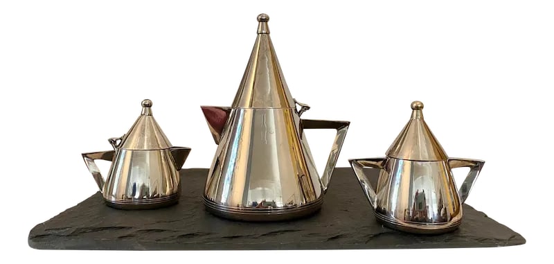 Postmodern Memphis-Style Tea Set, Set of 4 Pieces (After Michael Graves): Fantastic Postmodern Memphis-Style Tea Set. Each piece marked "EPNS" to base. Slate 16"W x 12"D x .5"H Teapot 6"W x 4.75"D x 7.75"H Cream Pitcher 4.25"W x 3"D x 4.25"H Sugar 4.75"W x 3"D x 4.25"H Cond
