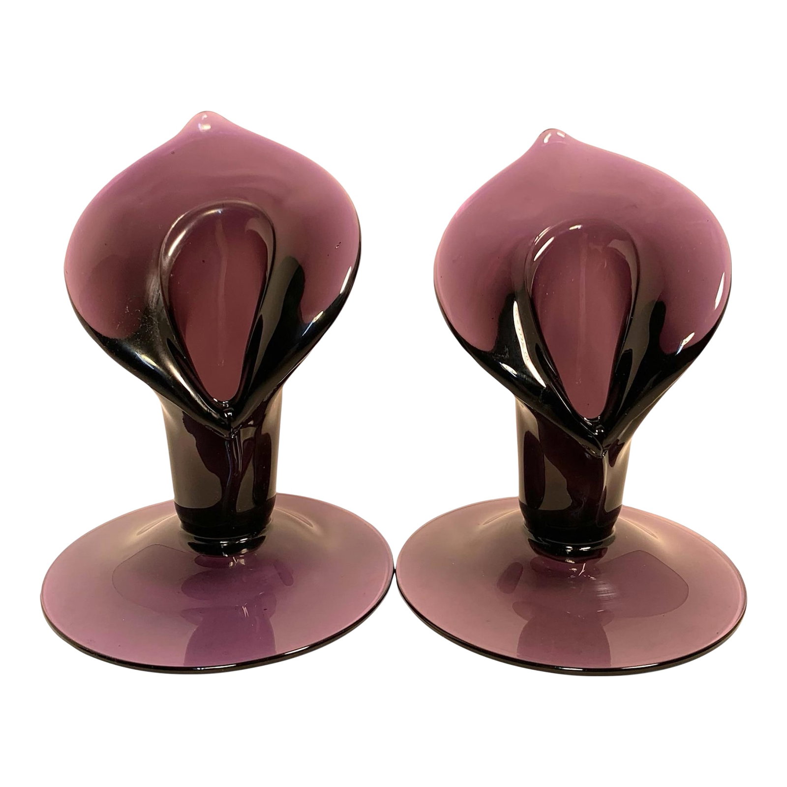 Circa 1900 Amethyst Glass Jack-in-the-Pulpit Bud Vase Pair: This matched pair of unmarked amethyst art-glass Jack-in-the-Pulpit bud vases dates to approximately the turn of the twentieth century and reflects the Art Nouveau fascination with stylized botanical 
