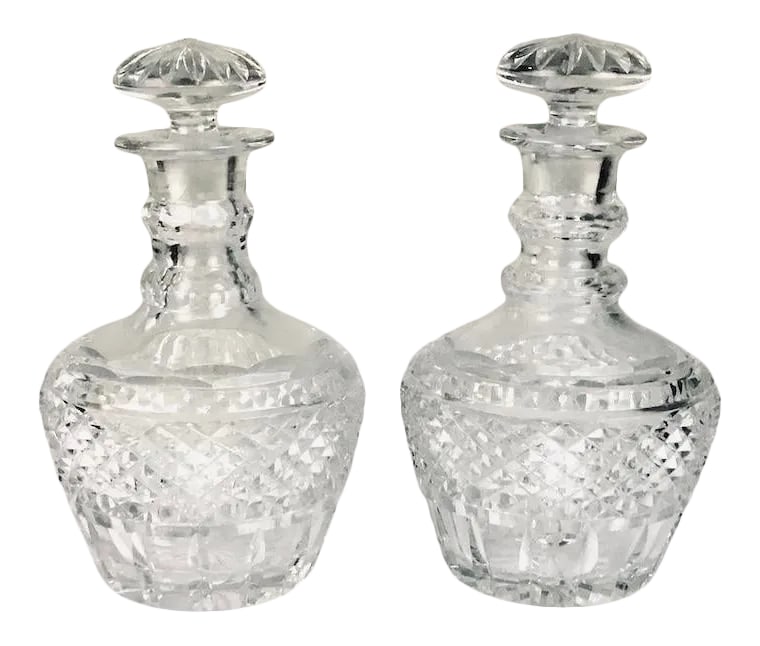 Georgian Cut Glass Decanters - Pair: These Georgian cut glass decanters have three neck rings -diamond cut with fluting and a mushroom shaped stopper-they are crystal clear and in perfect condition -very rare to have a matched set from