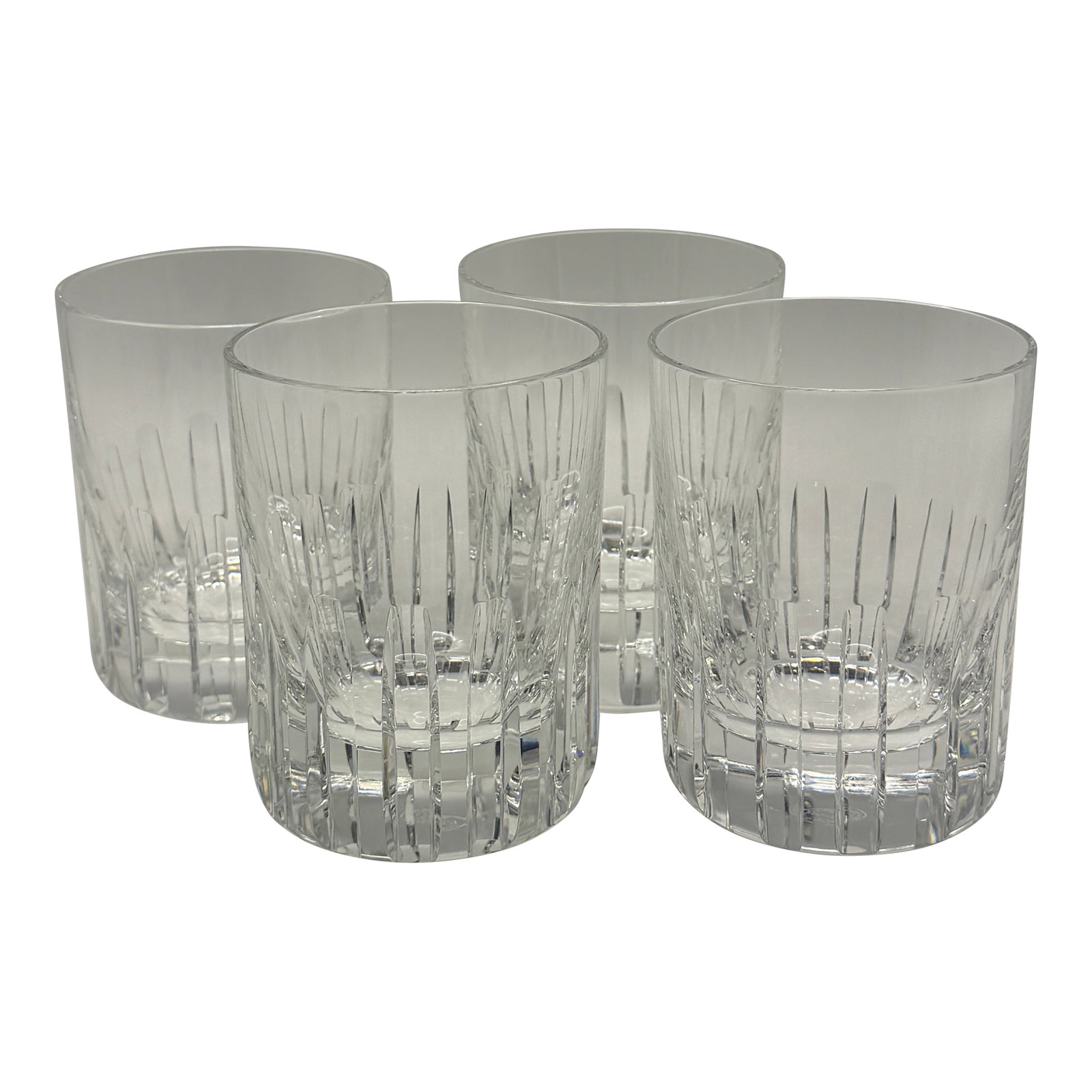 Vintage Set of Four Baccarat "Timber" Double Old Fashioned Glasses: A striking and highly sought-after pattern featuring deep vertical cuts and Baccarat's signature clarity and weight. Perfect for whiskey, cocktails, or elevated bar decor. All four glasses are in
