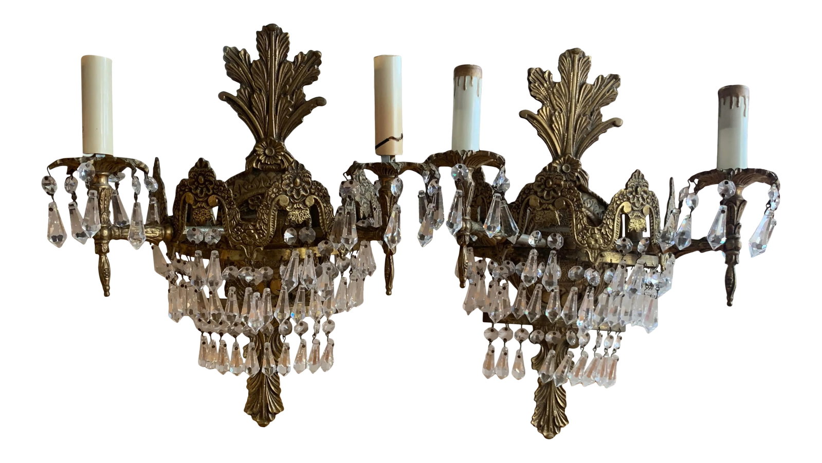 Early 20th Century French Art Deco Cut Crystal Sconces - a Pair: Pair of antique French cut crystal and bronze Art Deco sconces. Very unique and gorgeous workmanship, hand forged bronze and hand cut crystals shield 4 bulbs on each lamp. Grand french decor will high
