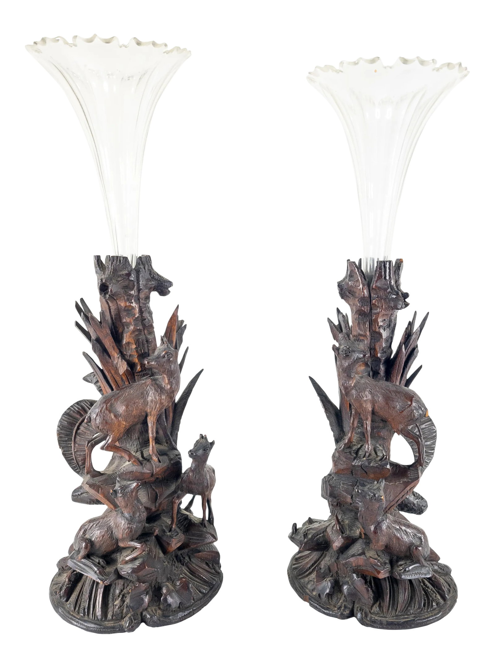 Pair of German Carved Black Forest Walnut Vases: We are selling this pair of Black Forest carved vases with glass inserts. This matching pair of Austrian or German carved walnut vase holders have mountain goats on the side with some floral decoratio