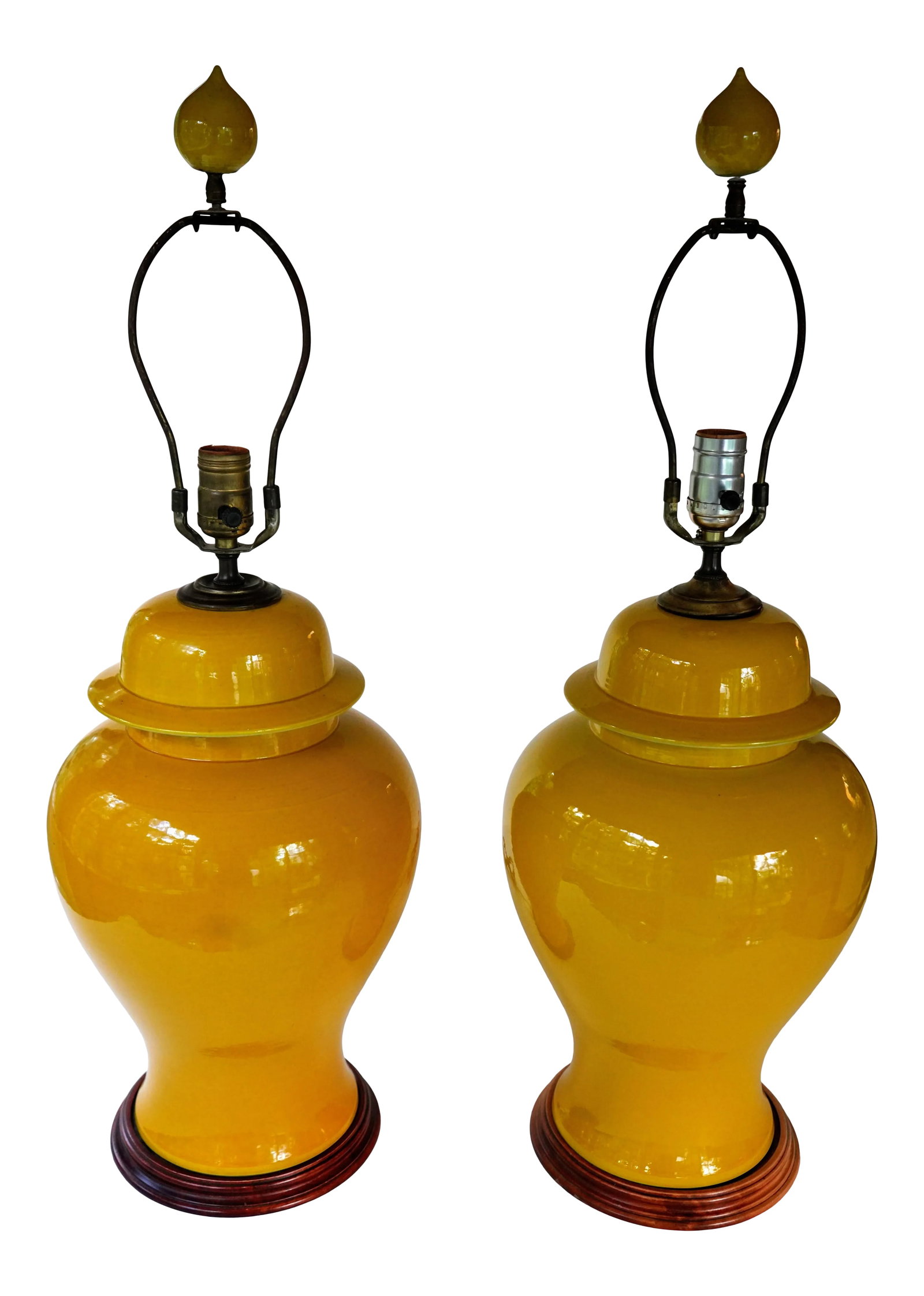 Mid Century Marigold Yellow Ginger Jar Lamps With Matching Finials - a Pair: Pair of mid-century marigold yellow ginger jar lamps with matching genie bottle finials. Each lamp has a wood base. Dimensions: 29" H x 12" D x 12" W, approximately 21" H to top of socket Condition Re