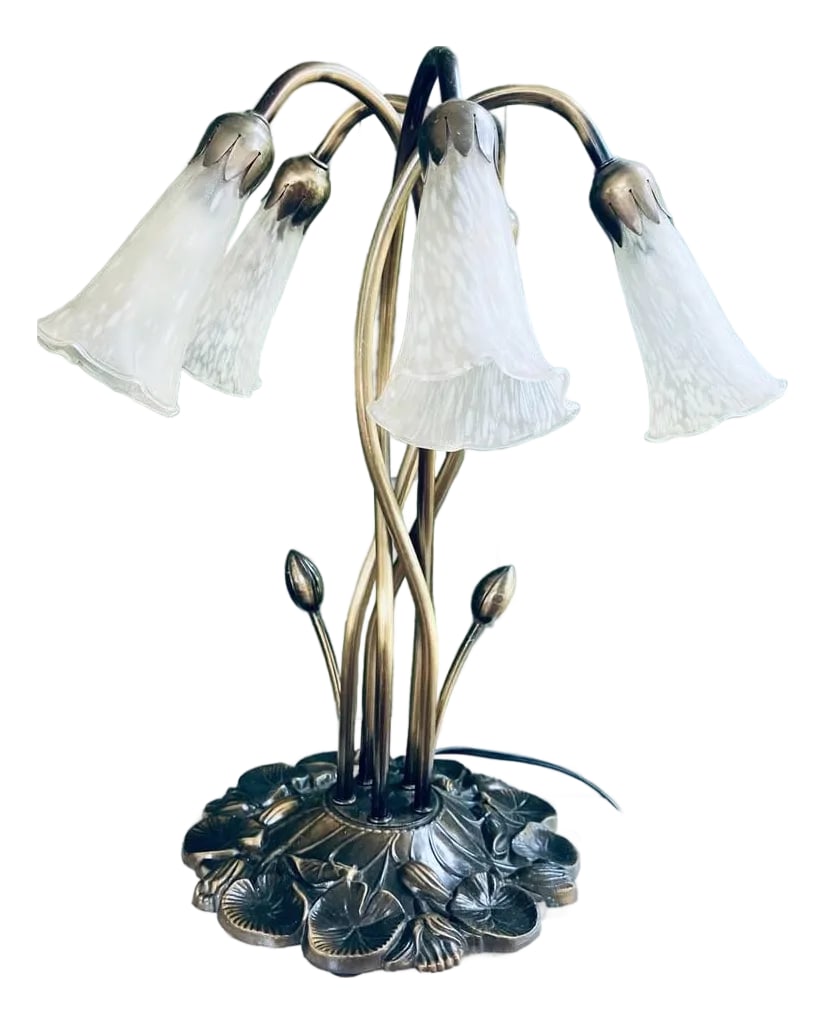Art Nouveau 'Favrile' Lamp, After Louis Comfort Tiffany: This delightful Meyda Tiffany rendition of Louis Comfort Tiffany's original 'Favrile' lily-pad lamp adds a fresh, delicate touch to any setting. THE HISTORY: Louis Comfort Tiffany (1848-1933) was a