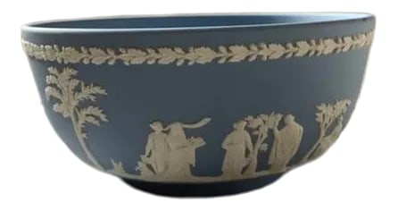 1950s Blue Wedgwood Fruit Bowl: Wedgewood Bowl in excellent condition. Beautiful trademark blue with white raised design. Excellent sizable piece for your collection. Condition: Alterations: Original Condition Unaltered