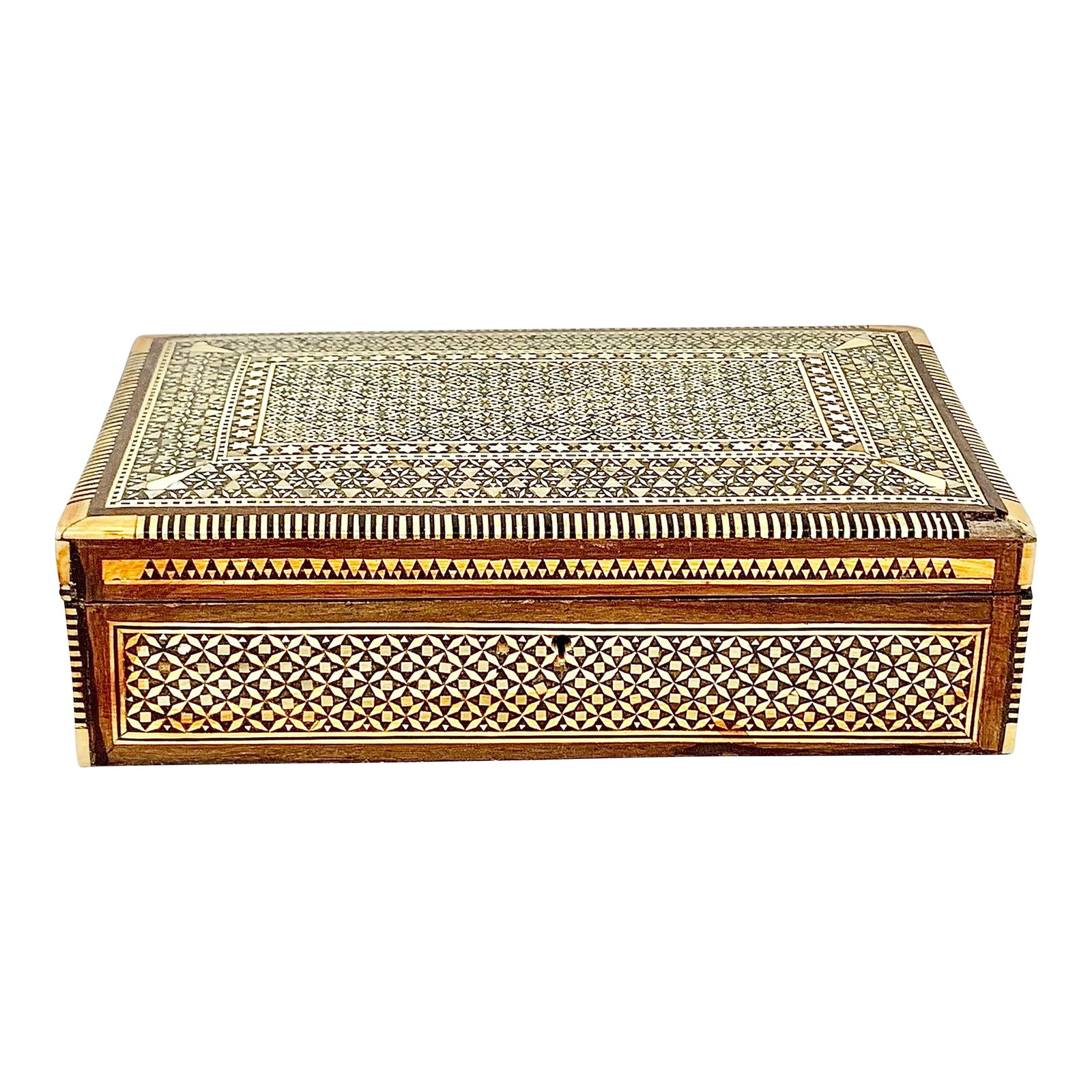 Mid 20th Century Vintage Rectangular Inlaid Mother of Pearl Jewelry Box: Beautiful vintage jewelry box. Made of wood with mother of pearl and wood inlay. Intricate geometric design. Comes with a key. Perfect to display or use to store your jewelry. This is a pre-owned item