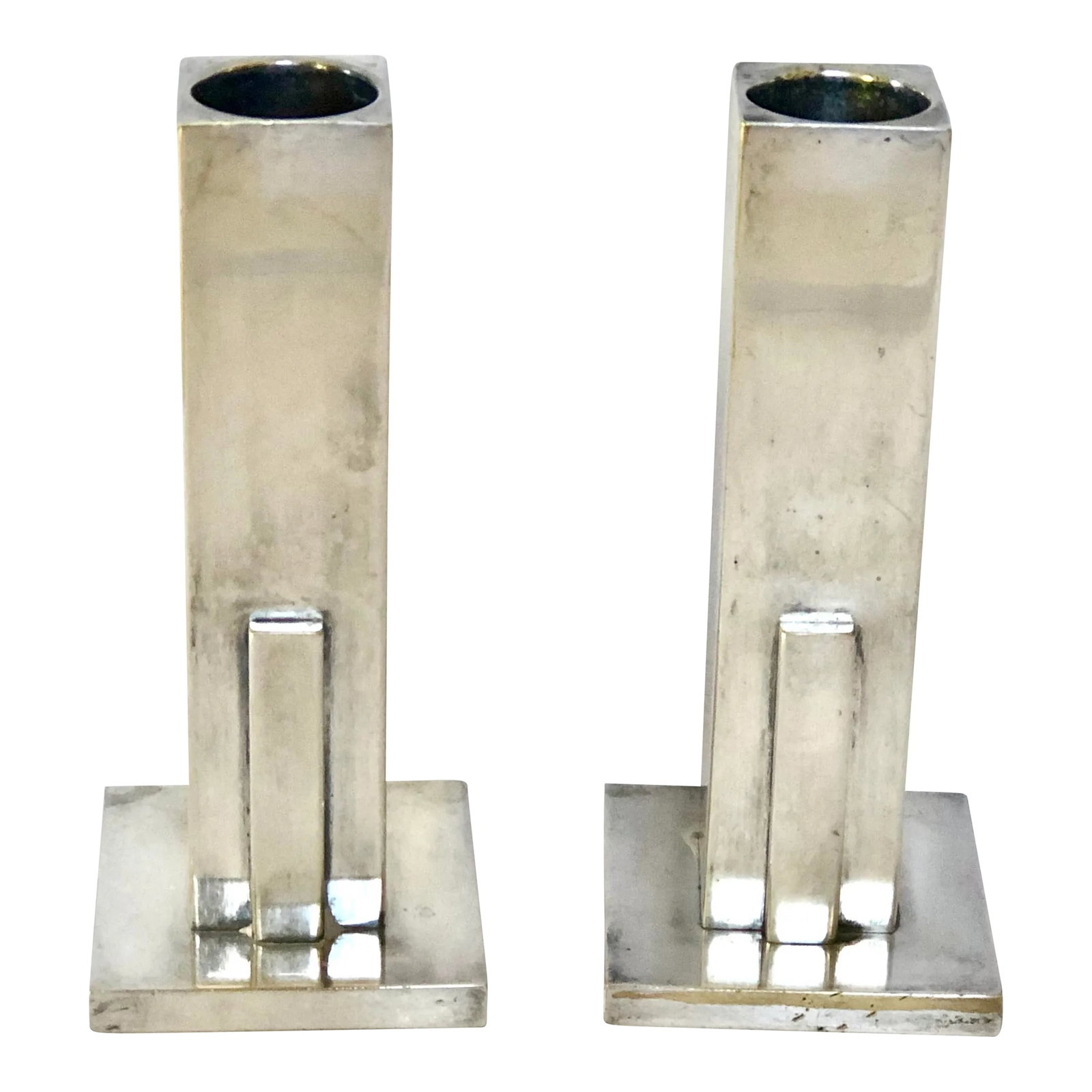 Art Deco Skyscraper Silver Candlesticks: San Francisco artist, Merle Faber, made these stunning Art Deco candlesticks in the 1940's in the popular skyscraper style of the time. These are silver plated with makers mark on the bottom.