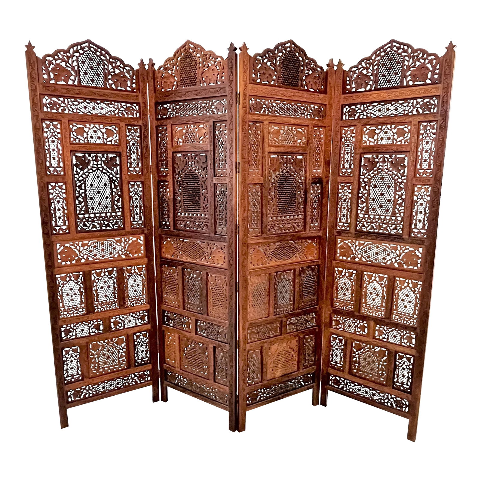 Mid 20th Century Moroccan Style Pierced Fruitwood 4-Panel Floor Screen: Awesome vintage Moroccan style four panel floor screen from the 1960's. Made of a natural medium tone fruitwood with pierced and carved leaf and floral details. It has a lace-like delicacy giving it l