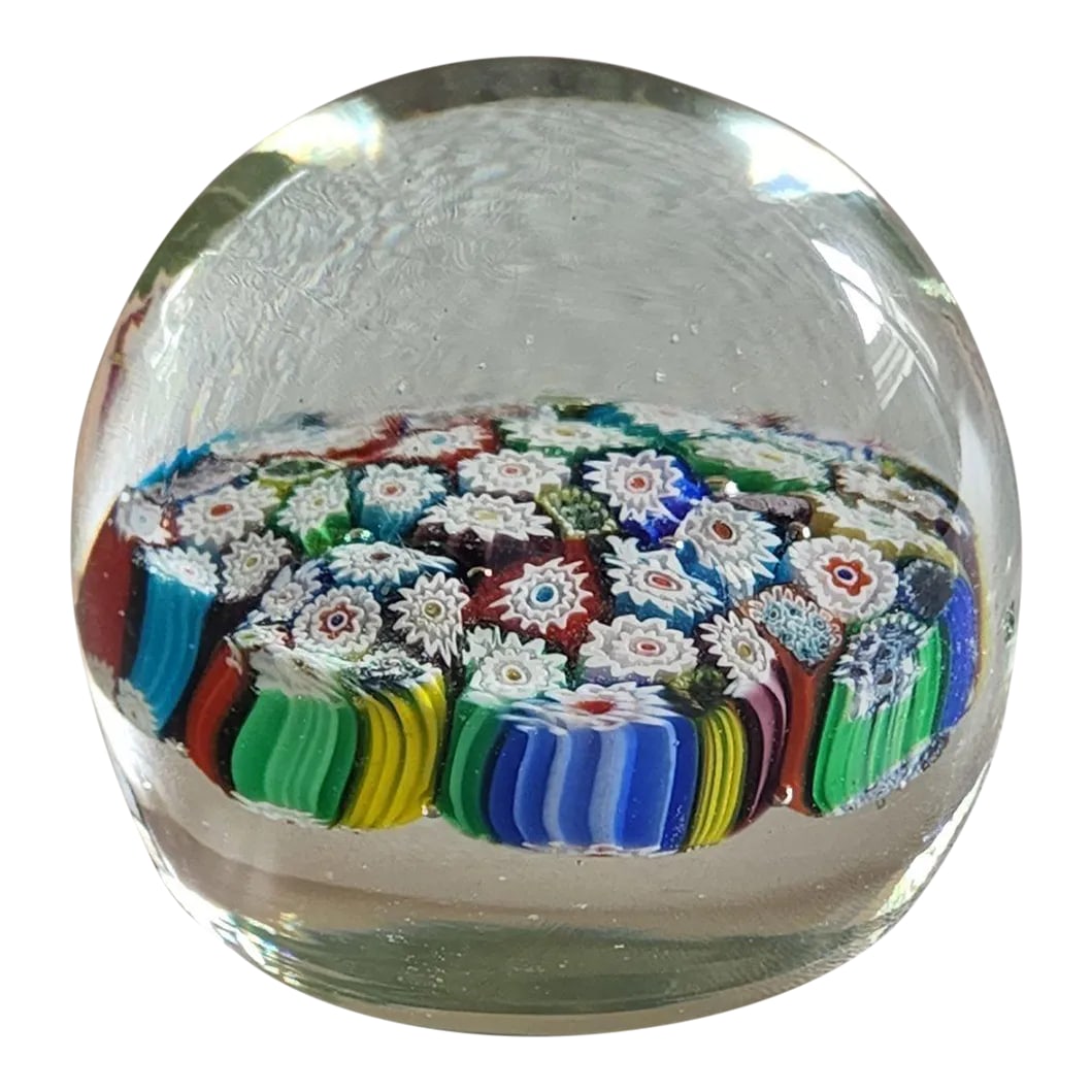 Vintage Millefiore Style Murano Art Glass Paperweight: Clear domed Murano style art glass paperweight of close!y packed multicolored floral canes. The outside of the canes form a colorful rainbow band. Acquired in Italy in the 1970's. Condition: