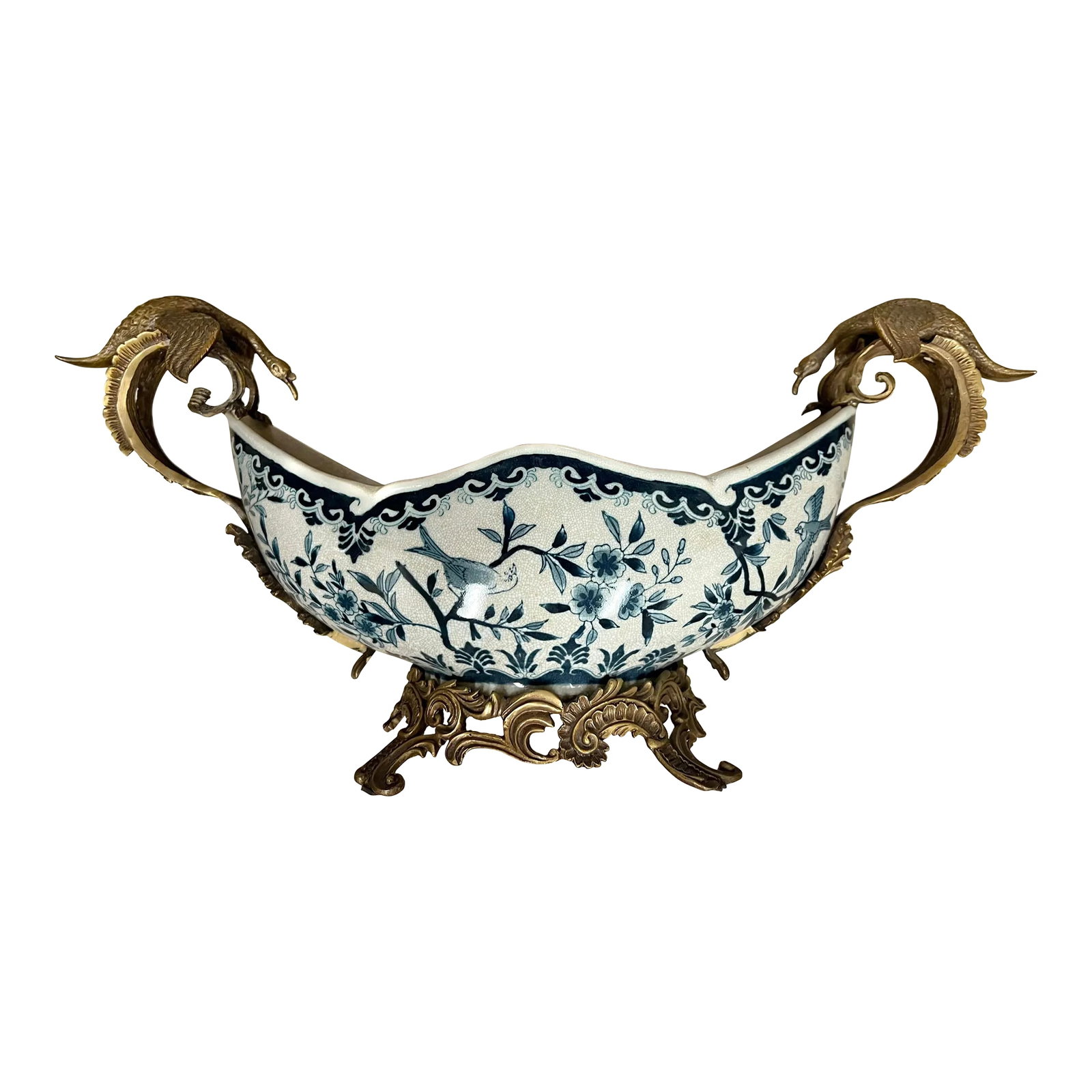 Antique Large Footed Cachepot With Dragons by Coalport: Large Cachepot with brass footed base and dragon/bird handles. Makes a great centerpiece. Measuring 23.5" x 7.5" and stands 11" tall. Blue and white Ceramic bowl has crazing. Condition: Alterations: O