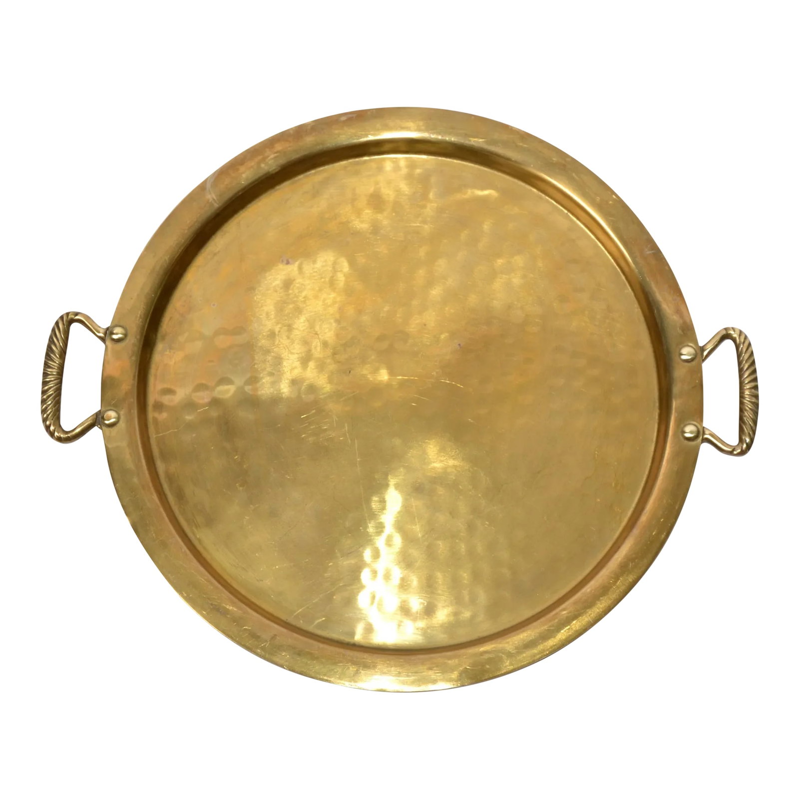 Early 20th Century Arts and Crafts Round Hammered Brass Serving Tray: Early 20th Century round hammered Brass Butler Tray, Platter Serving Plate from the Arts and Crafts Period. Features an elevated rim Brass Plate, Hammered Center and fitted with Twin Rope Handles. In