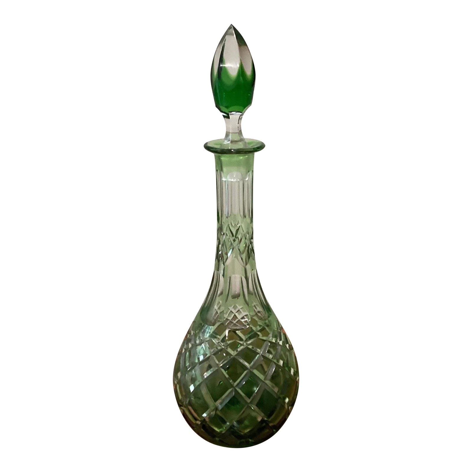 Emerald Green Cut to Clear Cased Crystal Wine Decanter Circa 1930: Rare early 20th century crystal decanter with Emerald green overlay and cut-to-clear decor. Mouth-blown and hand-polished to perfection. Incredible quality and design. The decanter is an eye-catcher