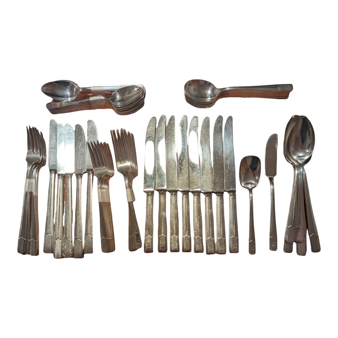 Vintage Napoleon Flatware Set for Eight- 65 Pieces: Rare Art Deco Elegance: Holmes & Edwards "Napoleon" Silverplate (65-Piece Set) Own a striking piece of American design history. This comprehensive 65-piece service for eight is rendered in the