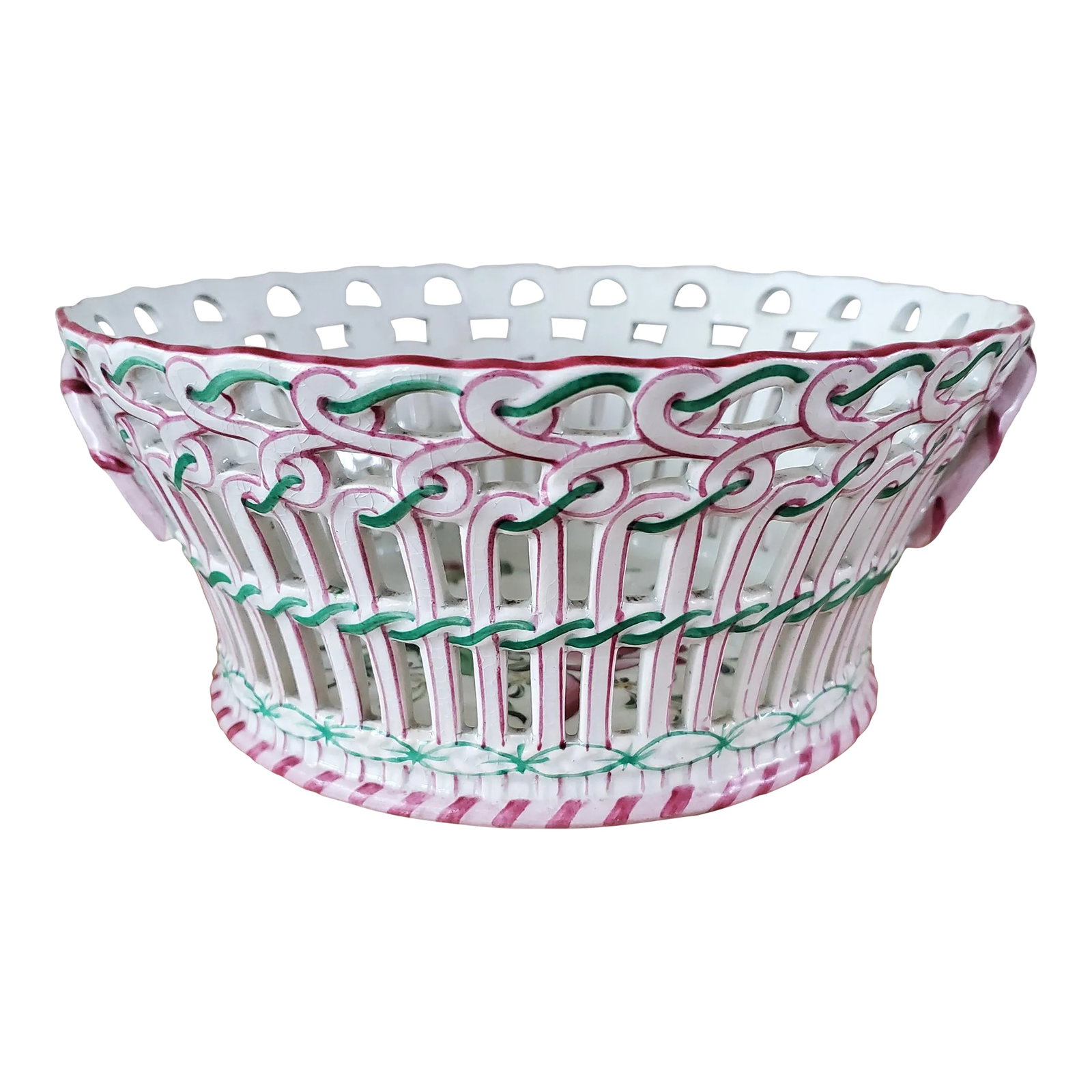 Antique Keller and Guerin Luneville Basket French Faience: Gorgeous antique French Faience Keller and Guerin Luneville reticulated lattice basket made in the early 20th century. Hand painted in pink and green with flowers on the bottom of the basket. The