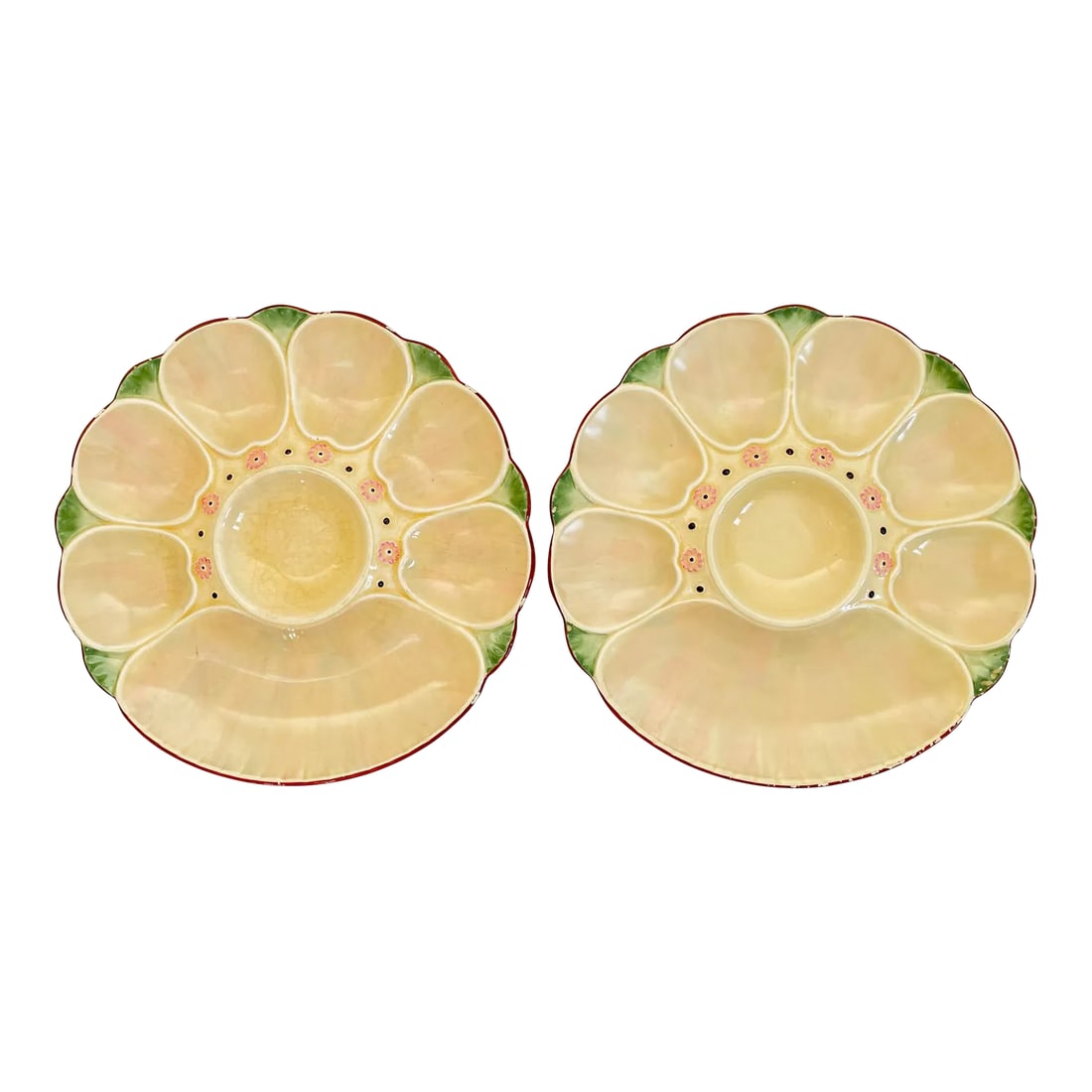 19th Century English Minton Majolica Oyster Plates Pair: A pair of lat 19th Century English Minton Majolica oyster plates with six oyster wells and a large well for crackers surrounding a center well for sauce. Luminous cream and pink glaze with pale green