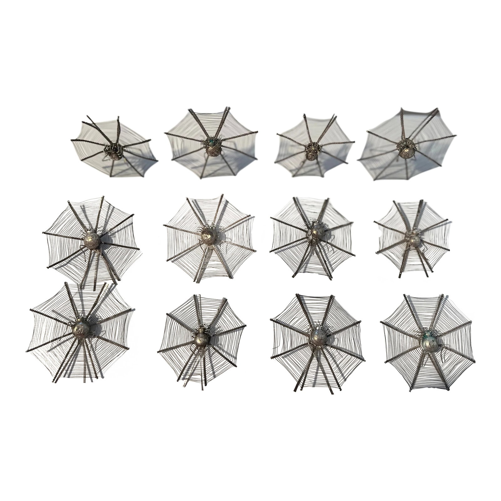 Set of 12 Chinese Export Silver Spider Web Form Place Card Holders: Chinese Export, early 20th century. A set of 12 Chinese Export silverplate and sterling silver spider web model place card holders. Each piece has delicate silver webbing, a plated spider mounted to t