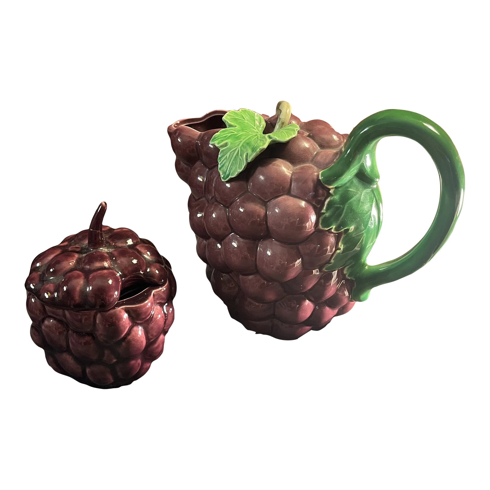 Vintage Majolica Style Grape Themed Ceramic Pitcher & Lidded Sugar Jar- Set of 2: Sculpted ceramic pitcher in the shape of a cluster of purple grapes complete with green vine and leaves. Love the color and detail of this especially the little leaf & stem on top of pitcher. Great ut