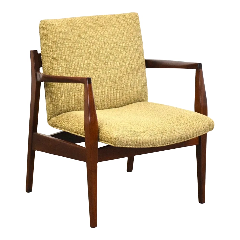 Jens Risom Walnut Lounge Chair: A mid century modern walnut lounge chair designed by Jens Risom. Frame was professionally refinished. Seat height is 16". 26.75" wide. 27" deep. 32" tall. Condition: Alterations: Restored