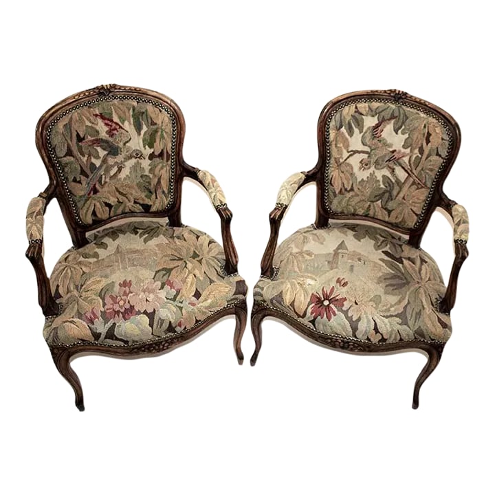 French Regency Style Tapestry Arm Chairs - a Pair: Pair of French Regency style arm chairs with vintage/antique tapestry upholstery. Regarding condition, one chair shows more wear than the other. Please see the close-up photos where flaws are noted.