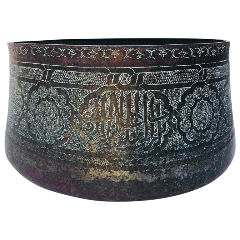 Antique Large Islamic Copper Brass Bowl: Large antique Islamic 19th century Middle Eastern Moorish hand-etched tined copper brass bowl, 17 inches diameter. Could be used as a jardiniere for a large orchids composition. With rounded base and 