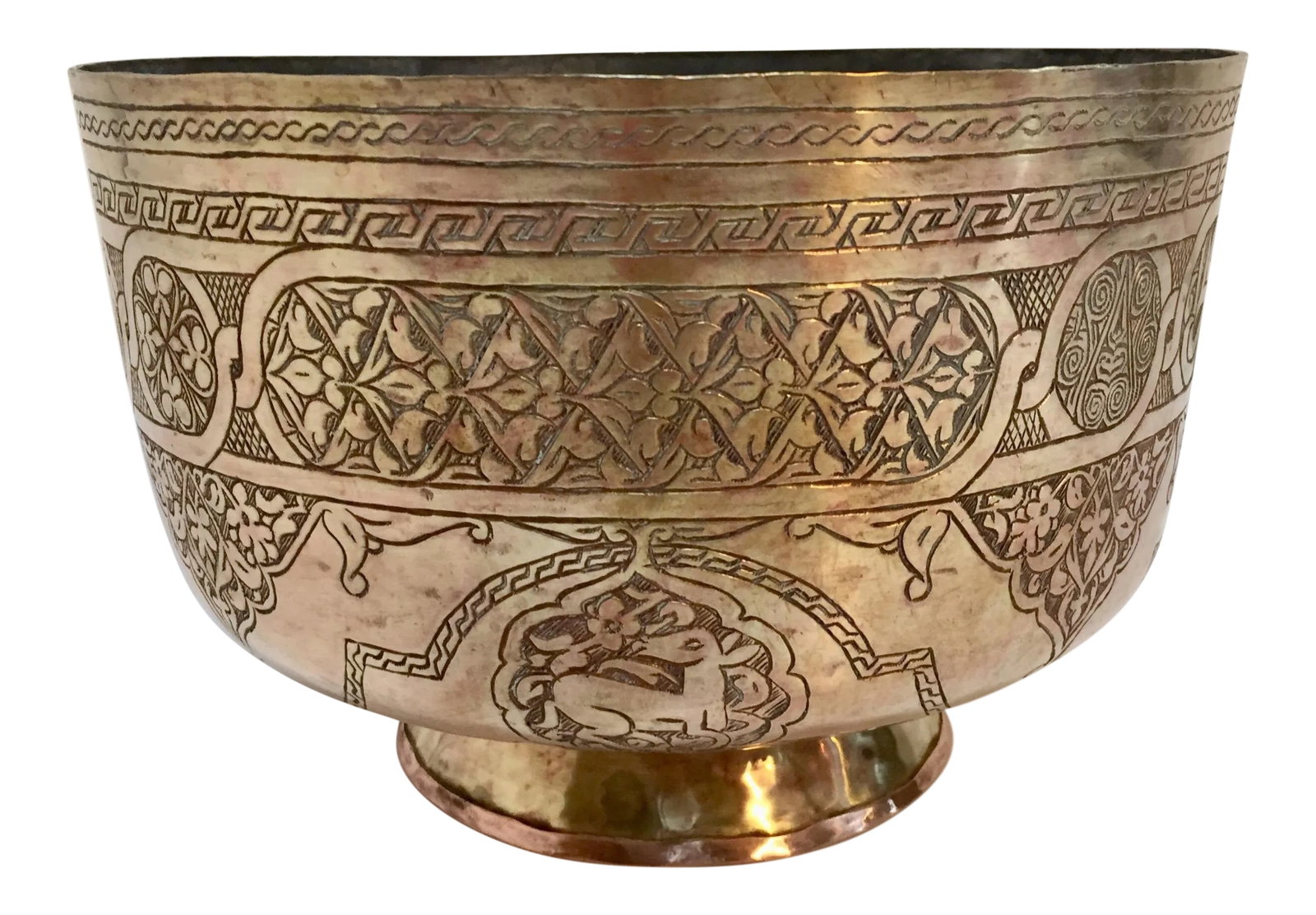 Islamic Middle Eastern Hand-Etched Footed Brass Bowl: Large Middle Eastern Islamic finely hand-etched brass memorial footed bowl decorated with medallions with Islamic calligraphy inscriptions and scene of wild animals. Persian hand-etched Mameluke style