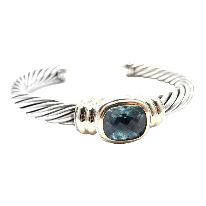 D.Yurman NOBLESSE 14k YG Sterling Silver Blue Topaz Bangle Bracelet: D.Yurman NOBLESSE 14k YG Sterling Silver Blue Topaz Bangle Bracelet Metal: 18k Yellow Gold & Sterling Silver Length: 7" Weight: 48.9 grams Width: 6.5mm Hallmarks: D.Y. 585 925 S154eod Please reference