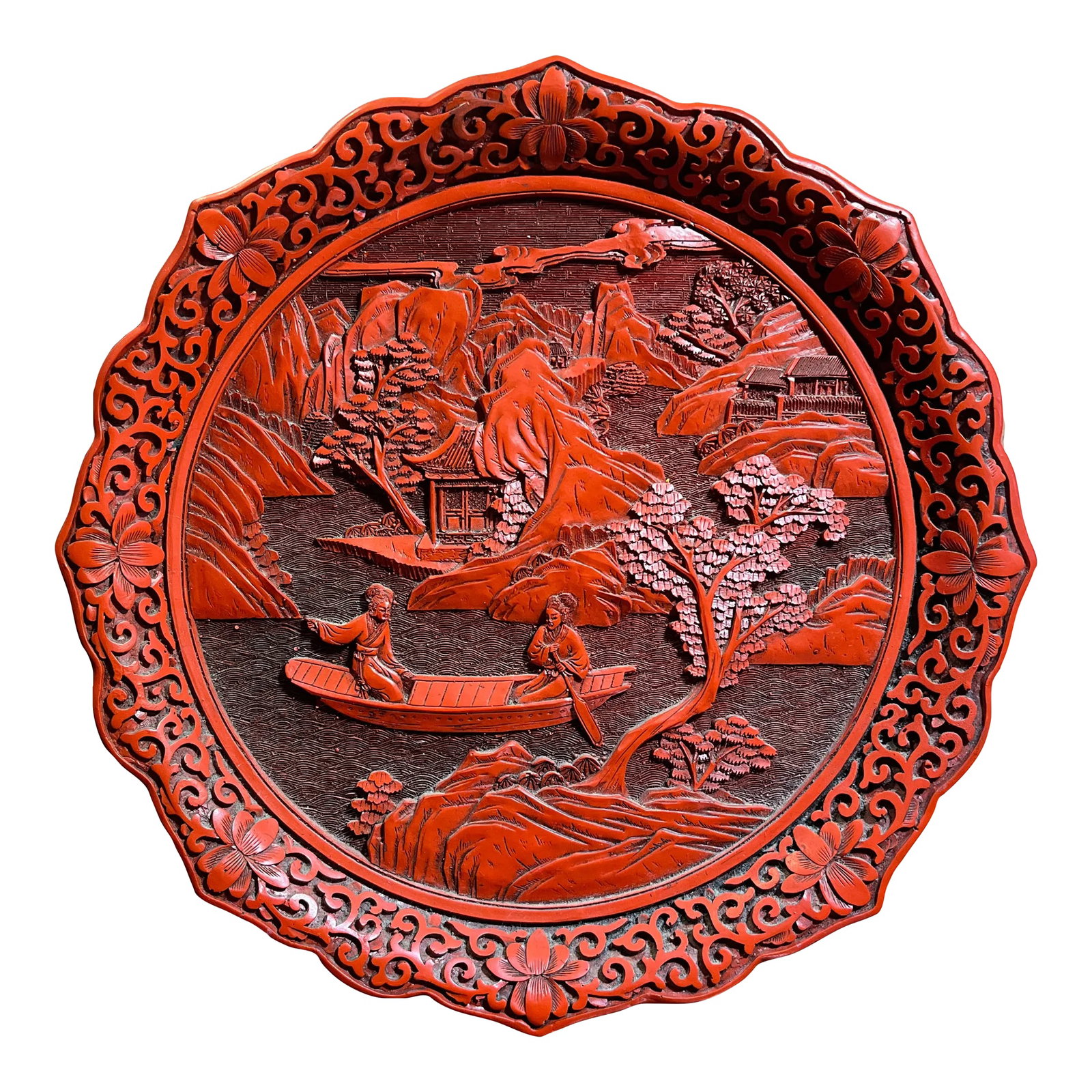 Vintage Chinese Cinnabar Decorative Display Plate: Detailed carving and a rich red color make this an attractive display plate. Flared rim with chased foliate pattern and on the reverse side a deep black lacquer finish to the bottom. Condition: