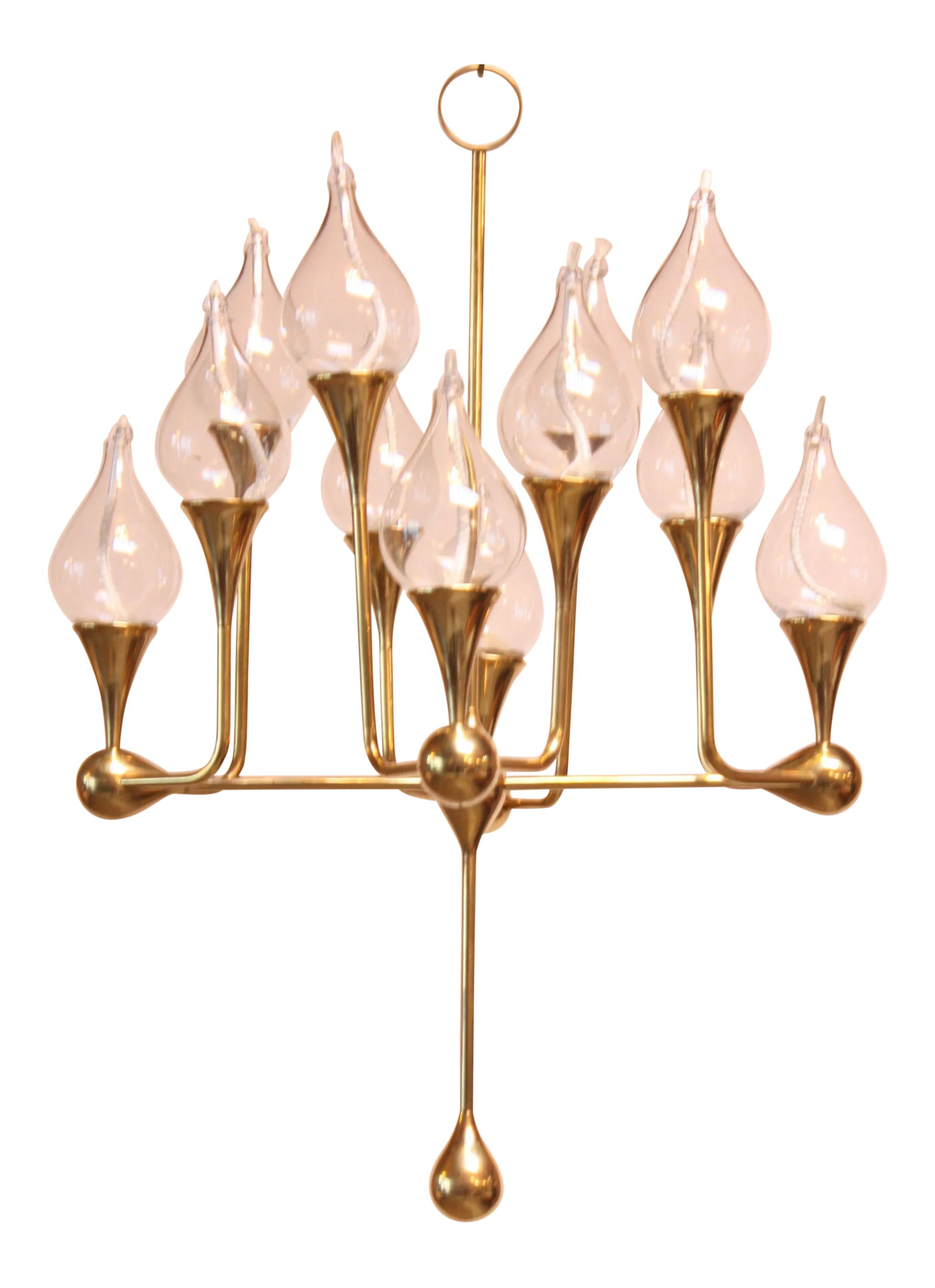 West German Brass and Glass Oil Lamp Candelabra by Freddie Andersen: Scarcely seen twelve-arm oil lamp candelabra designed and handmade by Freddie Andersen (W. Germany, 1970s). Glass oil candles are a lovely, tear-drop shape. Brass has been polished to revitalize its o