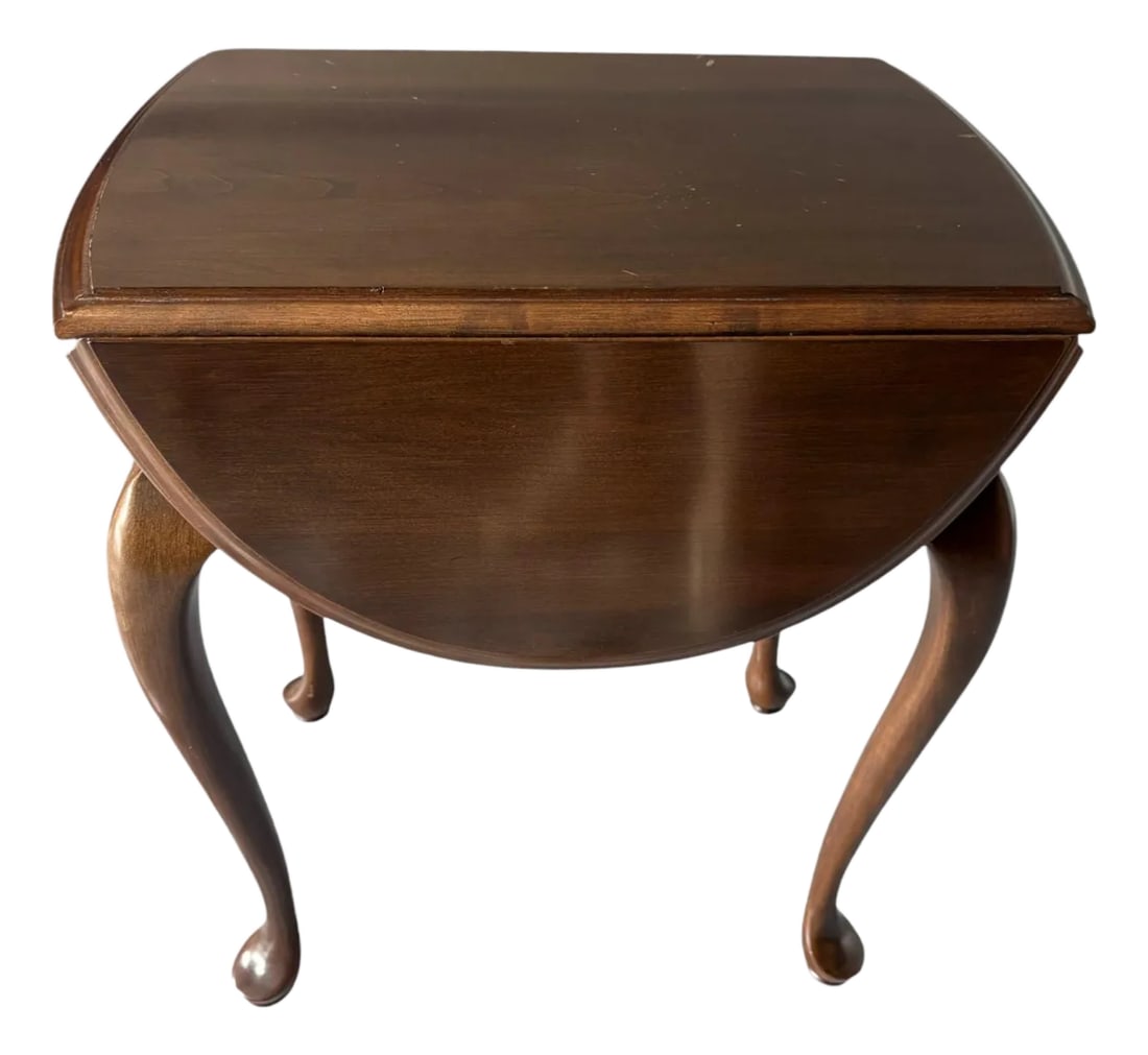 Ethan Allen Georgian Court Oval Drop Leaf Side Table: Quick Hits: Classic Ethan Allen craftsmanship Georgian Court Collection drop-leaf table Solid cherry with satin-sheen finish Perfect for small space styling or traditional seating areas More About Thi