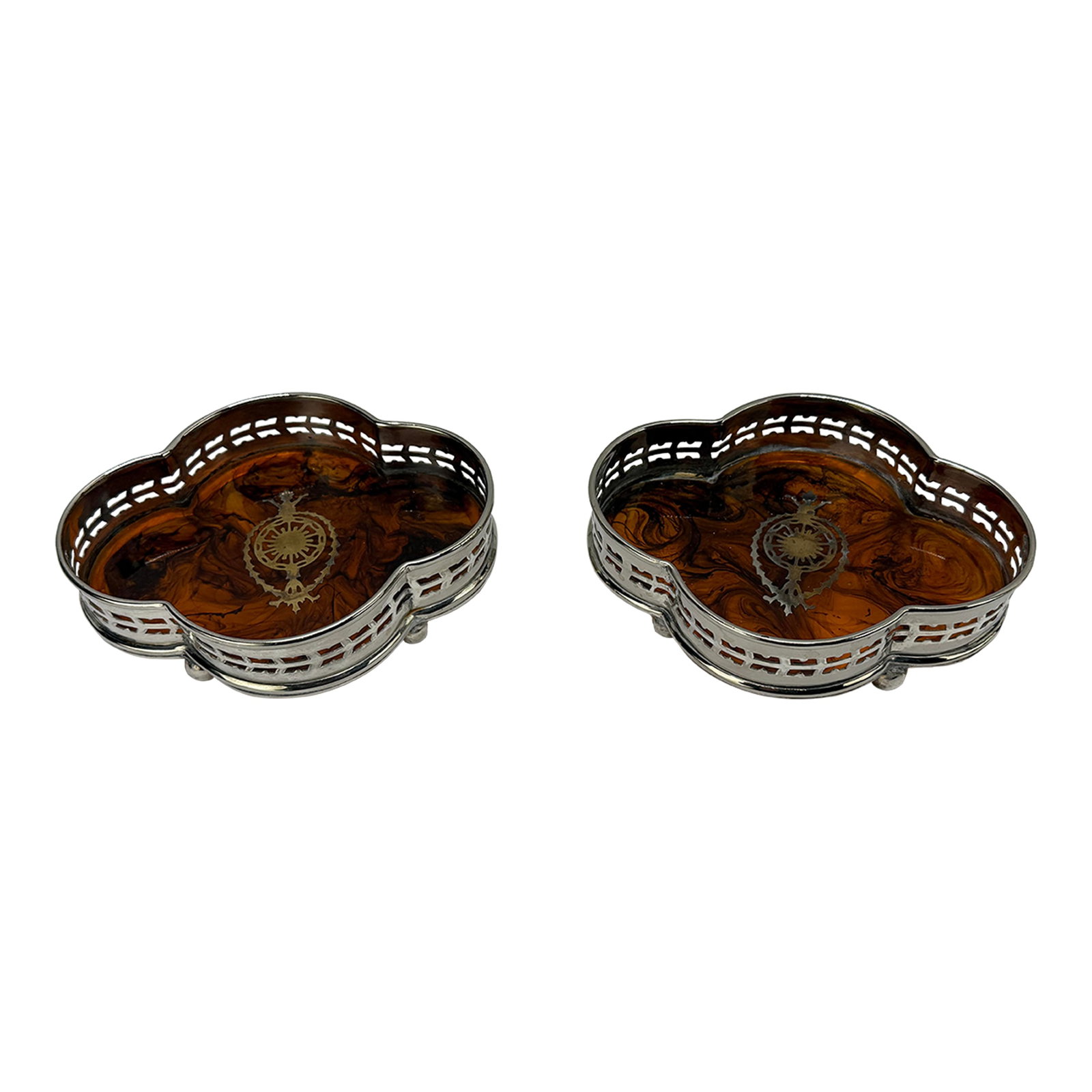 Pair, English Faux Tortoiseshell & Silverplate Gallery Edge Wine Coaster: This elegant pair of vintage wine coasters exemplifies the refined craftsmanship and sophisticated design typical of early to mid-20th-century decorative tableware. Fashioned from gleaming silverplate