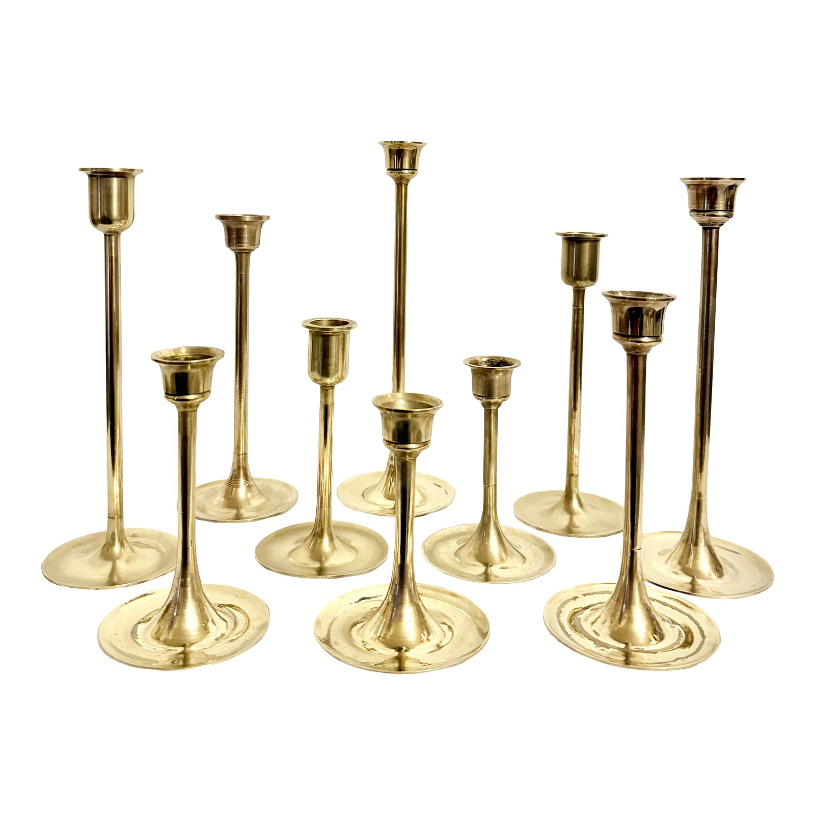 Vintage Curated Collection of Polished Brass Tulip Candlestick Holders - Set of 10: Imagine transforming your living space with this exquisite set of 10 Vintage Mid Century Modern Brass Tulip Candlestick Holders. Each piece in this carefully curated collection showcases a unique