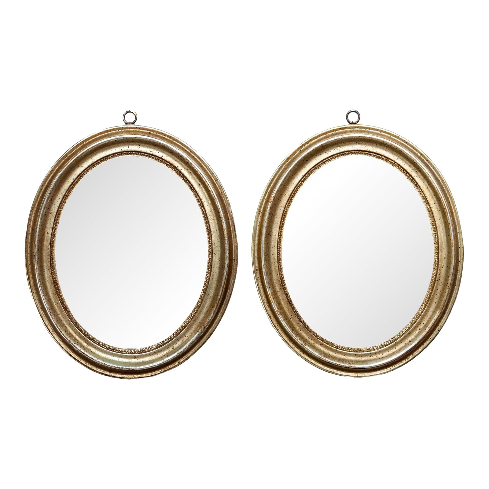 Pair of Oval 1950s Italian Borghese Gilt Wood Mirrors: A Charming Pair of Oval 1950s Italian Borghese Baroque Gilt Wood Mirrors. There are some age spots on the Mirror which adds to it's charm and age. There is an attached metal hoop on each for hanging.