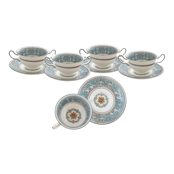 Wedgwood Florentine Soup Coupes/Saucers: Eight Wedgwood soup coupes and saucers in the iconic Florentine pattern. Crafted from fine white bone china, this set features vibrant jewel tones and intricate detailing that exude timeless elegance.