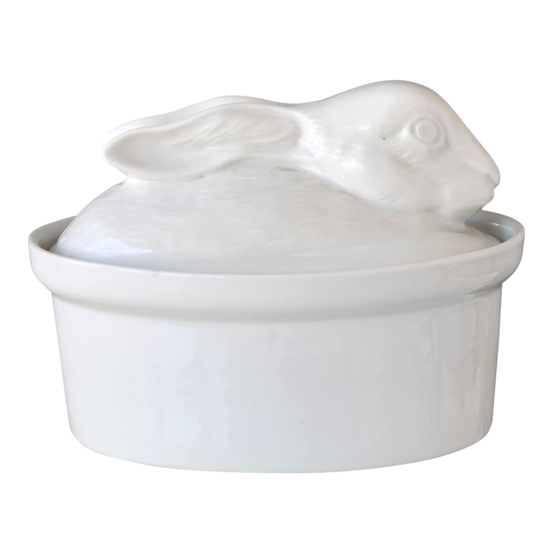French Porcelain Rabbit Tureen: Charming white French porcelain rabbit tureen with molded detail and glossy glaze. Likely mid-20th century, this lidded dish is perfect for pate, terrine, or as whimsical serveware. A sweet nod to