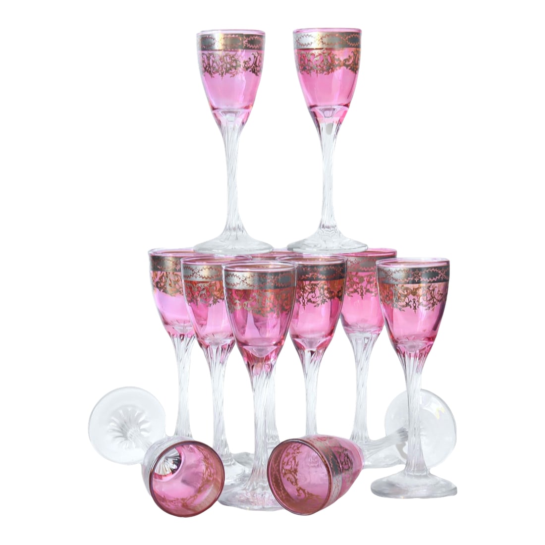 1920s Platinum & Cranberry Flash Stems, 11pcs: This exquisite set of 11 stemmed glasses features a stunning cranberry flash with platinum embellishments. Each glass holds approximately 3 ounces, making them ideal for serving liqueurs or cordials. 