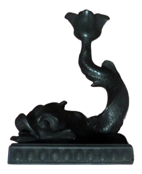 Early 19th Century Wedgwood Black Basalt Dolphin Candlestick: An early 19th c. Wedgwood basalt candlestick in the form of a dolphin resting on a rectangular plinth decorated with scallop shells. The dolphin's tail forms the candle nozzle. Nice detail throughout 