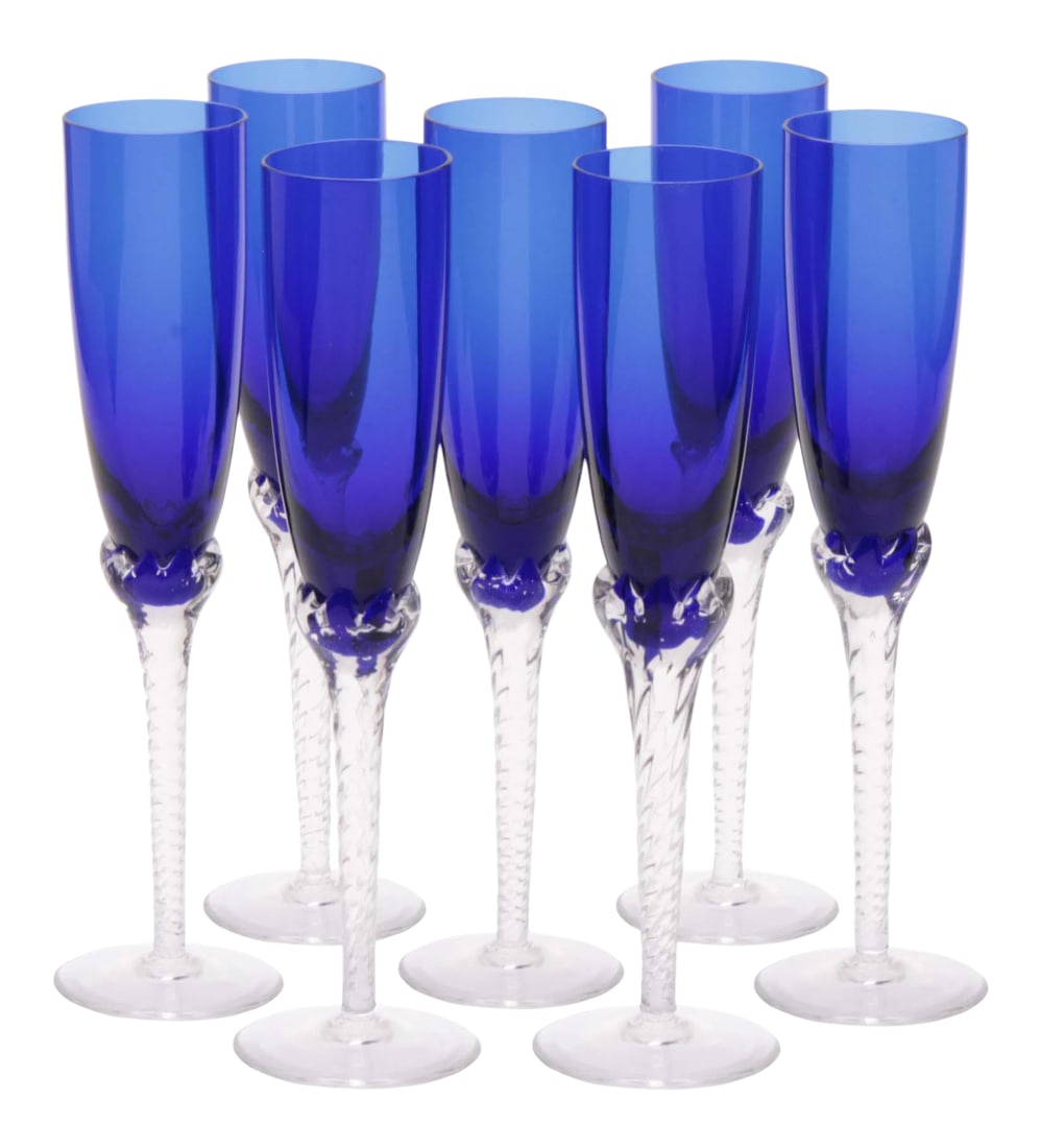 1980s Hand-Blown Crystal Champagne Flutes in Cobalt Blue With Spiral Twisted Clear Stems, Set of 6: Deep cobalt blue crystal champagne flutes with hand-blown and twisted stems. Produced in the 80s in Yugoslavia by Srpska Fabrika Stakla. Each holds 6 oz, is 10" tall, rim is 2" diameter, blue body of 