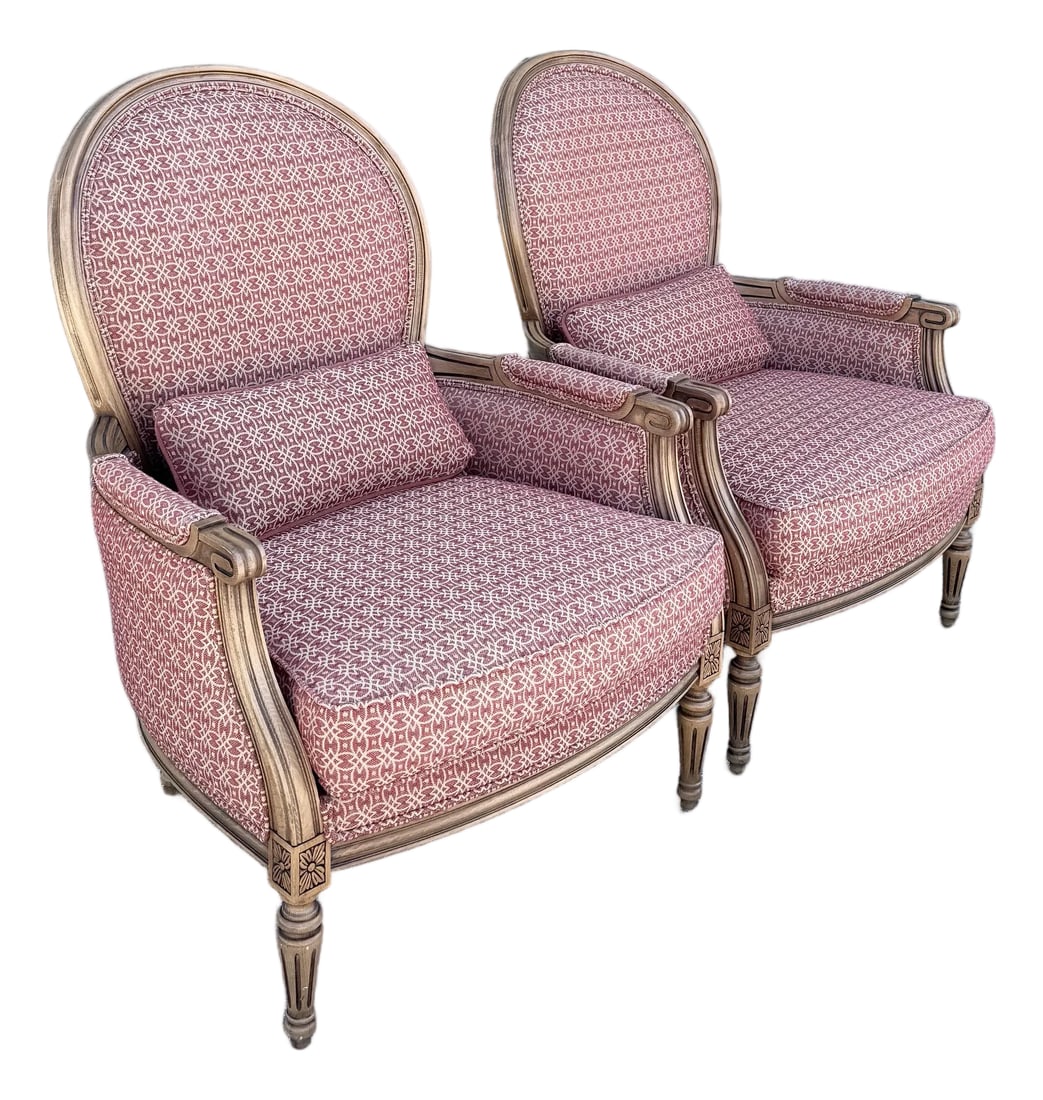 Vintage French Provincial Lounge Chairs by Ethan Allen - A Pair: A refined pair of French Provincial lounge chairs by Ethan Allen, showcasing timeless elegance through their gracefully carved wood frames and classic silhouette. The rounded backs, fluted legs, and